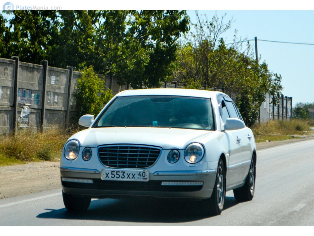 Kia Opirus белая